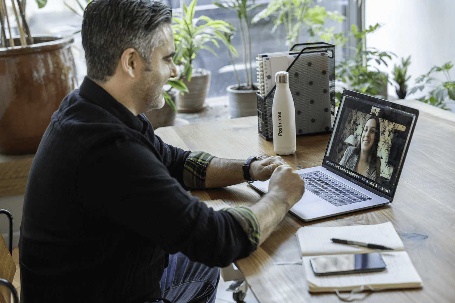 Image of a salesperson working in an office on a virtual call